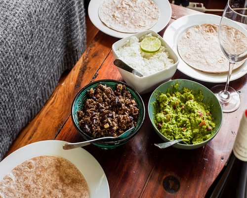 Traditional Mexican lunch with tortillas, beans and avocado